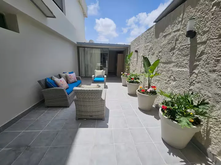 Wide view of the private outdoor terrace patio at Ciel Studio with outdoor seating