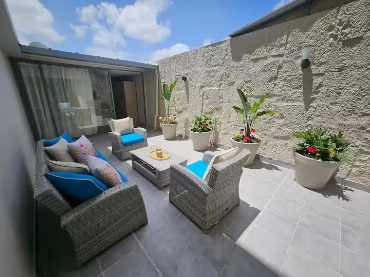 Private outdoor terrace at Ciel Studio with outdoor seating and potted plants
