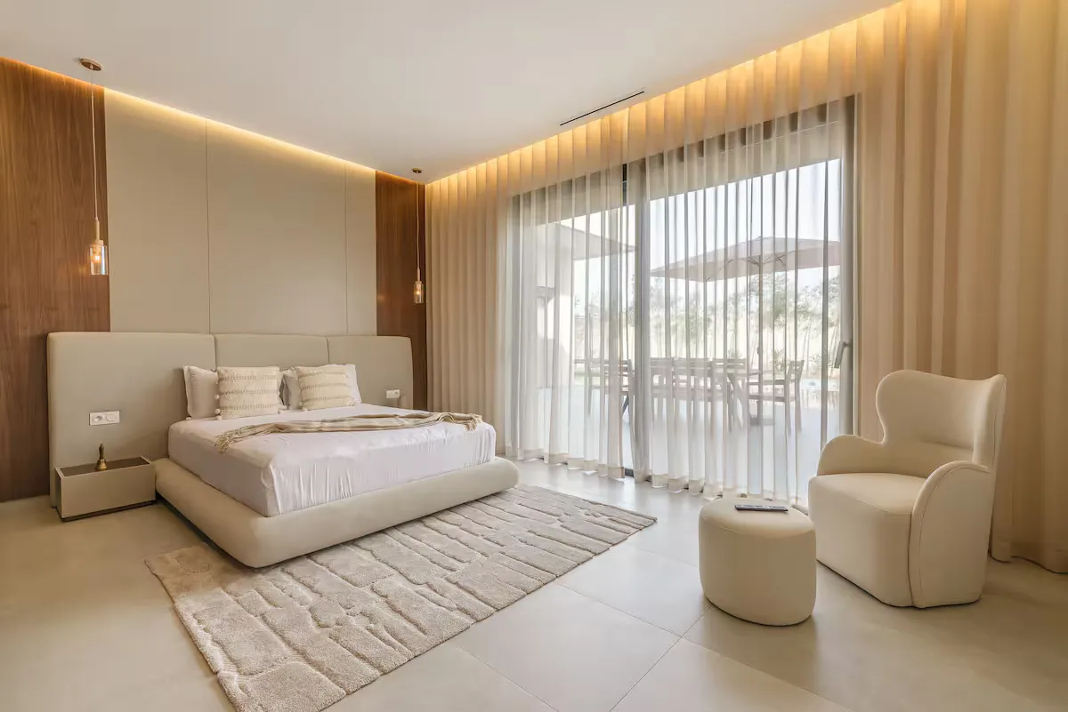 Villa Milabel - Elegant Master Bedroom with Garden View
