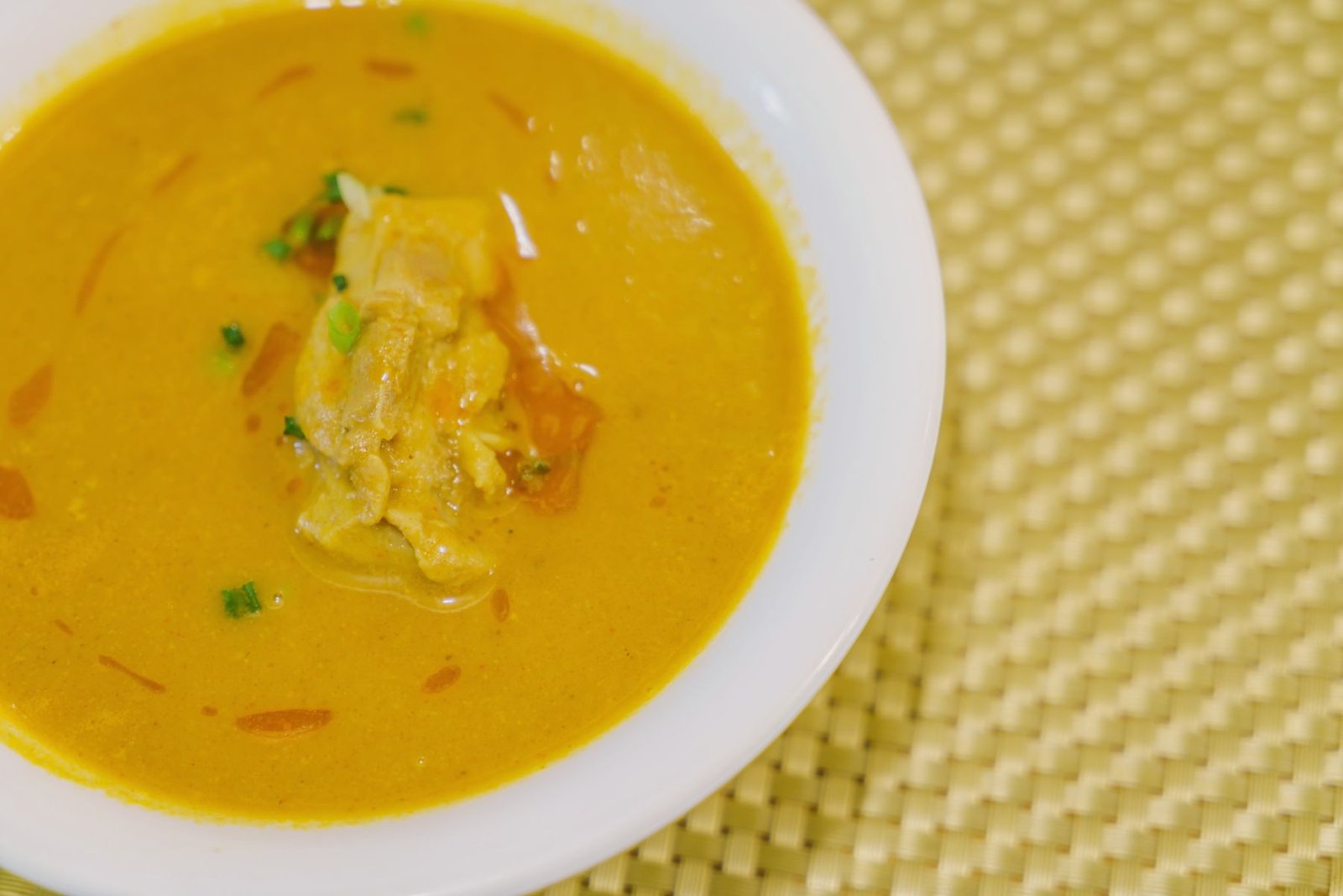 Bowl of traditional warm Moroccan soup seasoned with aromatic spices
